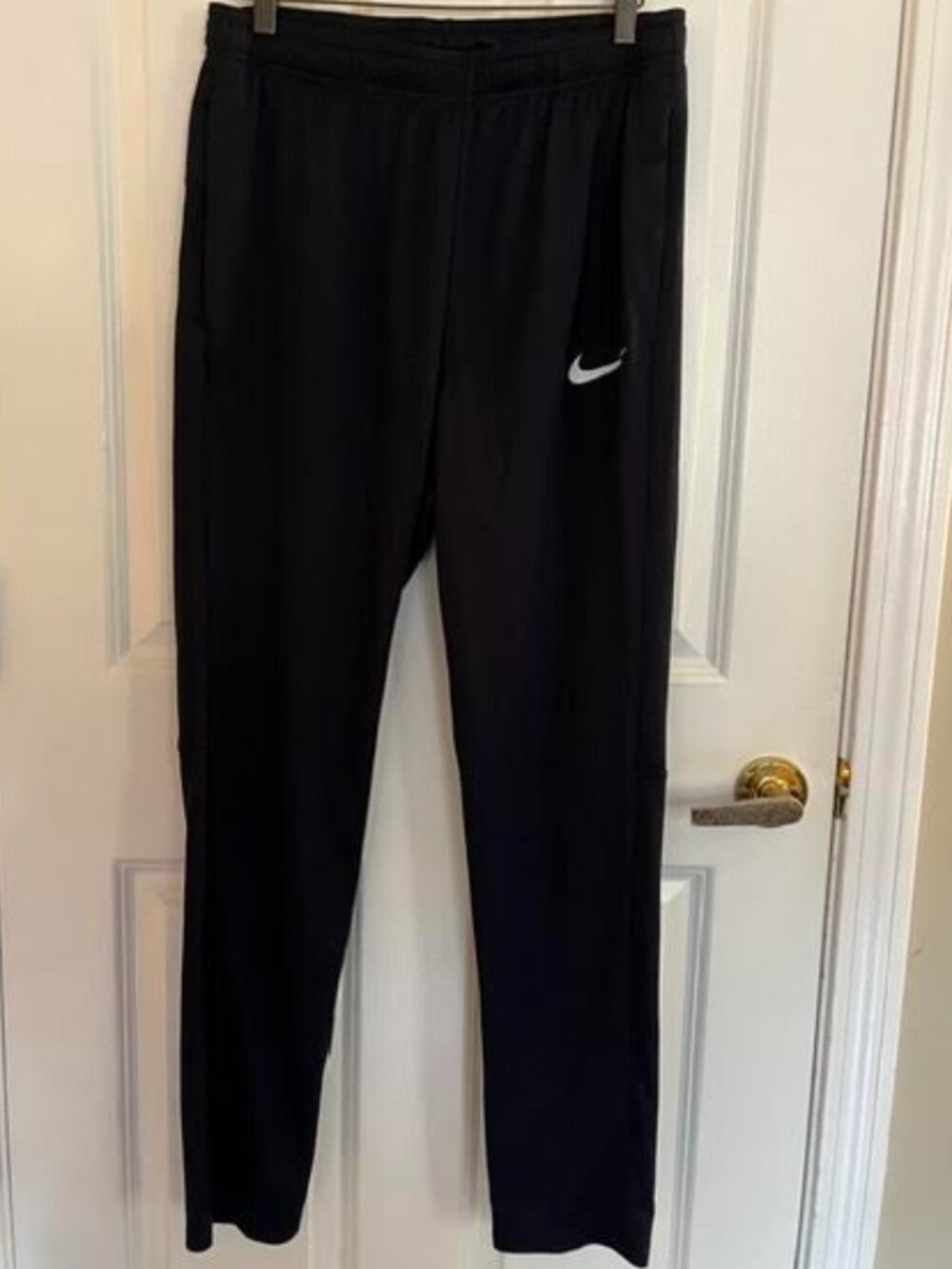 Nike dry fit black workout pants with pockets, size L, polyester.